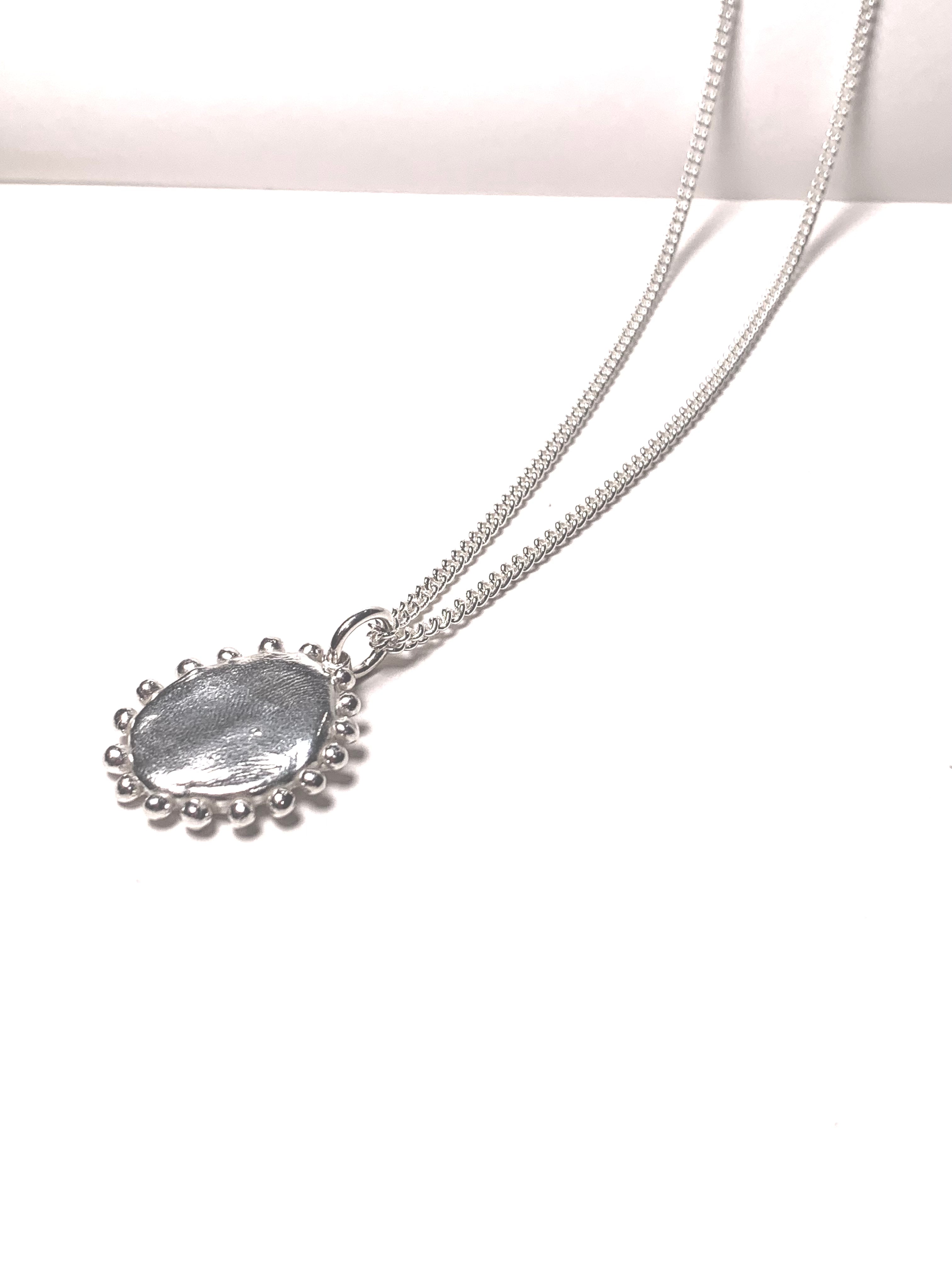 Sun pebble pendant necklace