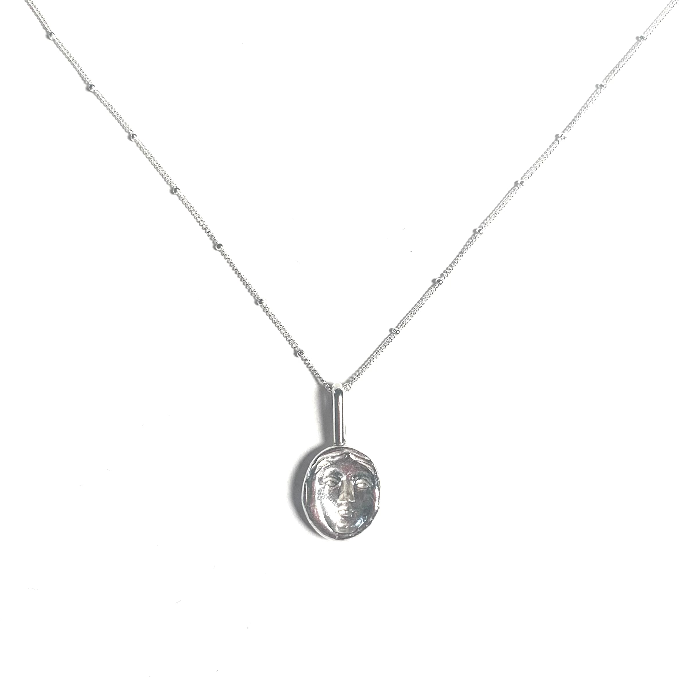 Concave face necklace